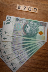 Five hundred of polish zloty. Close view. 700 PLN.  500 PLUS funding for children in Poland. 700...