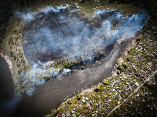 Landscape with fire, burning grass, top view from a drone.