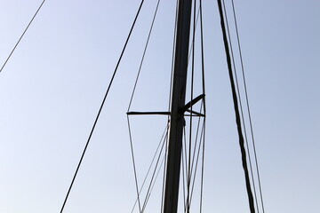 Ship masts against the blue sky.