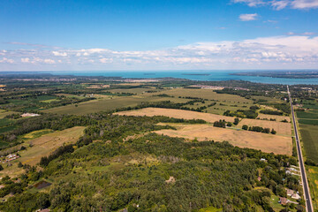 Obraz premium Innisfil water front beach shore line with farm land and lake simco in view 