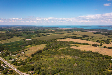 Obraz premium Innisfil water front beach shore line with farm land and lake simco in view 