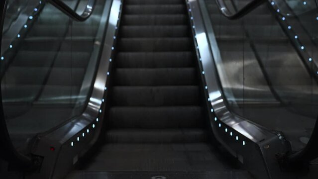 Electric escalator in metro. Moving staircase.