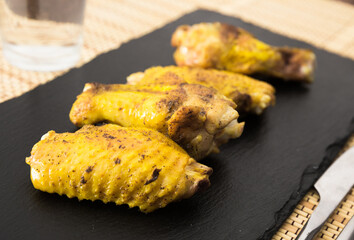 fried chicken wings on white plate