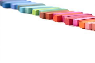 Colorful chalk pastels in a row, on white background