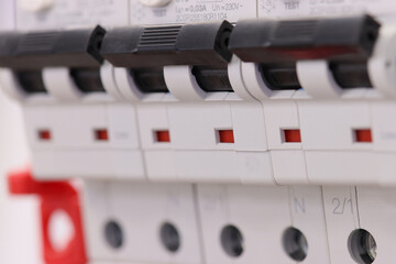 Automatic current switches for protection of electrical loads installed in the electrical panel. Soft focus.
