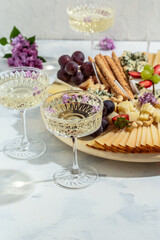 Antipasto platter of various types of soft and hard cheese. spanish manchego cheese, ham, prosciutto, jamon. Dinner or aperitivo party concept. catering banner, menu, recipe