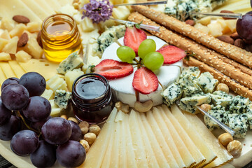 Antipasto platter, Antipasto Cheese board of various types of soft and hard cheese. spanish manchego cheese, aperitivo party concept, banner, menu, recipe place for text