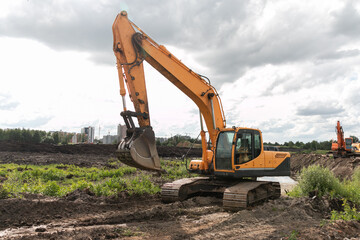 Crawler excavator digs the earth with a bucket.  Excavators are used when working in quarries and mine workings. Peat mining. Drainage of swamps.