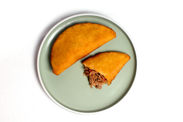 Fritish empanada stuffed with meat. Traditional food in Venezuela and Colombia
