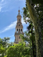 Vertical shot of the South Wing tower of Plaza de Espana. Seville, Spain. - obrazy, fototapety, plakaty