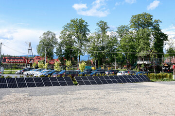 Fototapeta premium BIALKA TATRZANSKA, POLAND - MAY 28, 2022: Station with solar panels in the village.