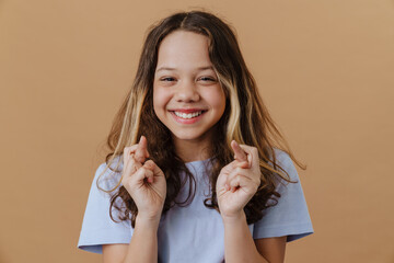 White preteen girl wearing t-shirt smiling and looking at camera