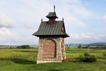 CZARNY DUNAJEC, POLAND - AUGUST 23, 2022: A roadside shrine nearby the Czarny Dunajec city.