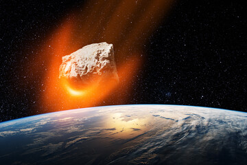 Fototapeta na wymiar Planet Earth and big asteroid in the space. Potentially hazardous asteroids. Asteroid in outer space near Earth planet. Elements of this image furnished by NASA.