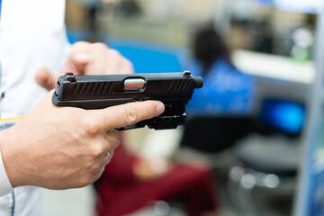 hand holding a semi automatic handgun