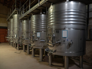 Stainless steel wine fermentation containers in a winery, Spain