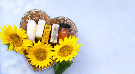 Handmade soap in straw basket made in the shape of heart against a background of light colors. Handmade organic soap concept from natural ingredients. Close-up
