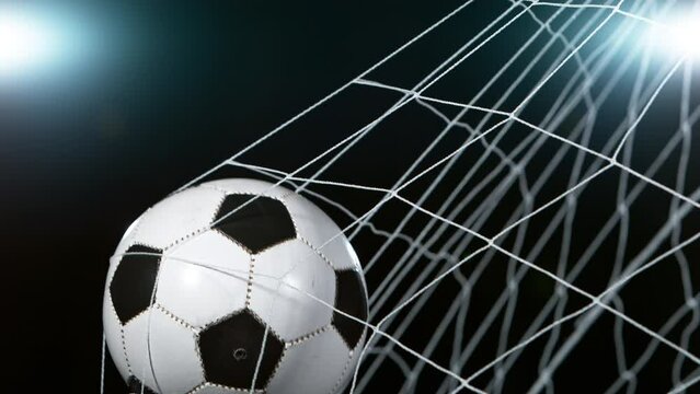 Close-up of Soccer Ball Hitiing Goal Net, Super Slow Motion at 1000 fps. Filmed on High Speed Cinematic Camera.
