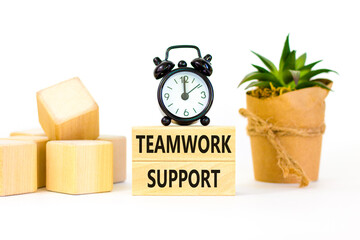 Teamwork support symbol. Concept words Teamwork support on wooden blocks on a beautiful white table white background. Black alarm clock. Business and teamwork support concept. Copy space.
