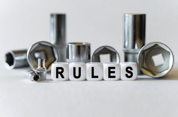 On a white background, a set with tools and white cubes with the inscription - rules
