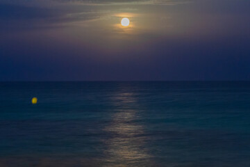 Cityscape of the Moon risinng from the mediterranean sea (Torrevieja,Alicante,  Spain)