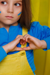 Ukrainian girl dressed in the color of the flag of her country. Patriots of their country. Children of Ukraine 