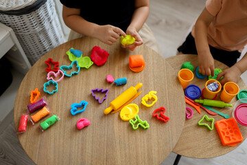 Children sculpt from plasticine, classes in a kids club, the concept of education and child...