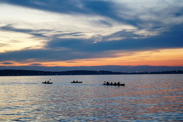 Kayaks on the lake at sunset