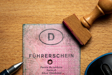 Oldenburg, Germany, August 22 2022, old used, dirty pink German driving license