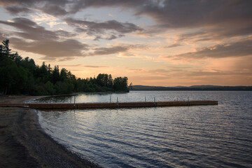 Fototapeta premium Beautiful sunset on a beach of a Canadian lake in Quebec