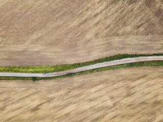 Aerial view of fast car on country road
