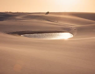Fototapeten  sand dunes of Lencois Maranhenses with blue water pools at sunset © Agata Kadar