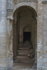 Fototapeta na wymiar Corridor with arches in ruin of the monastery with the Abbey Jumieges, Normandy, France
