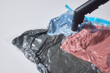 Space saver saving seal bag sucking air vacuum clothing storage compressed package.