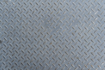 Metal texture, aluminum that serves as stair treads. Embossed details