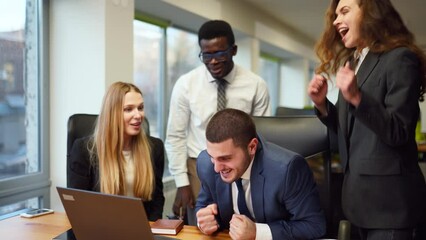 Diverse office corporate workers celebrate successful contract agreement. Multiethnic brokers rejoice about stock market deal victory. Excited business team gives high five about tender, auction win.