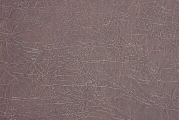 leather texture from a piece of brown dirty upholstery
