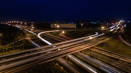 Fototapeta na wymiar over Road city highway at night - Bird eye viwe - drone -Top view