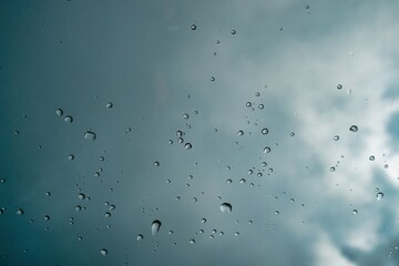 Texture background with drops on glass and sky