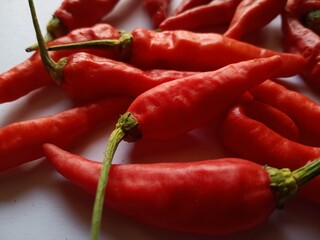 red hot chili peppers, chili on a white background, used as a food additive