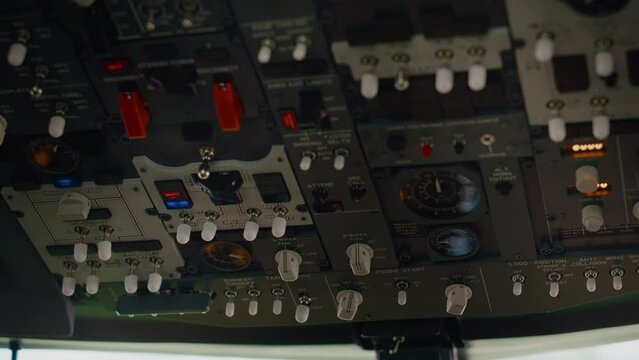 Aircraft dashboard command in empty plane cockpit used to fly with engine throttle and power speed. Control panel buttons and lever fot navigation with radar compass and windscreen. Close up.