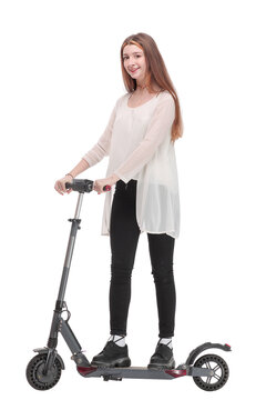 Young Happy Woman Is Standing A Back Near Her Kick Scooter