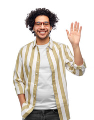 people and fashion concept - happy smiling man in glasses waving hand over white background © Syda Productions