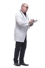 in full growth. a serious doctor writing a prescription