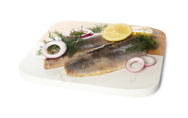 Board with delicious salted herring fillets, onion rings, dill and lemon isolated on white