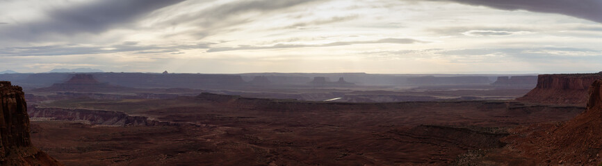 Scenic Panoramic View of American Landscape and Red Rock Mountains in Desert Canyon. Cloudy Sunset Sky. Canyonlands National Park. Utah, United States. Nature Background Panorama