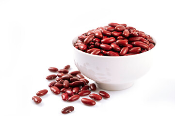 Red kidney beans in white bowl isolated on white background.