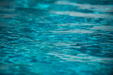 Tansparent clear calm water surface texture. Abstract nature background. Sea water pattern.