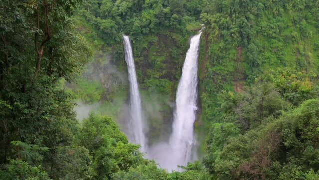 4K-Scenic Aerial view of Waterfall in green rainforest.The Tad Fane waterfall in Paksong Town,Champasak Province, within the Dong Houa Sao National Protected Area.Travel concept. Aerial footage.