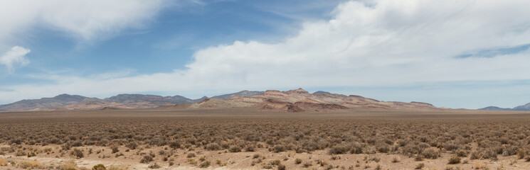 American Mountain Landscape in the desert. Sunny Cloudy Sky. Nevada, United States of America. Nature Background Panorama